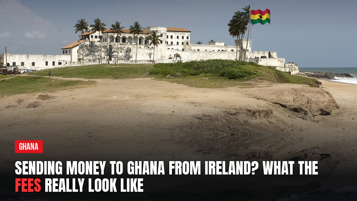 Elmina Castle, Ghana, with flag. Headline: Sending money to Ghana from Ireland? What the fees really look like.